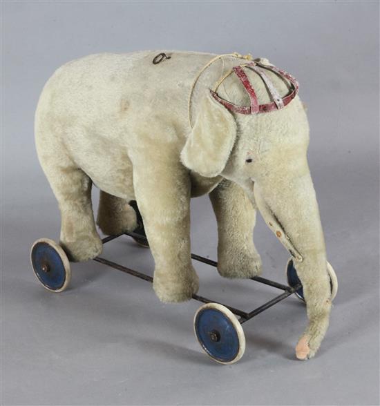 A Steiff pale gold plush pull along elephant, length 29in.